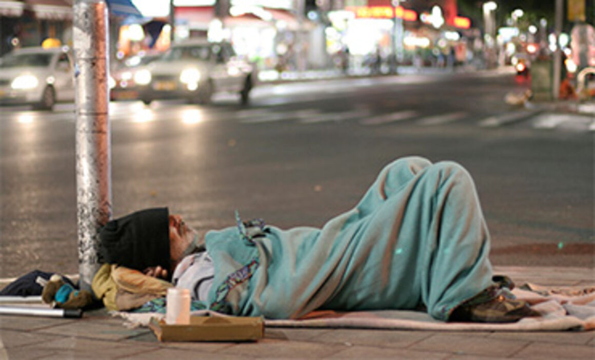 man sleeping in the street. © Istock
